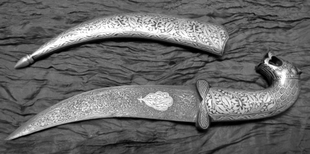 A beautiful example of a Damascus steel knife. Notice the dark patterns—similar to both soot and the cave paintings. Image source.