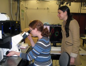 Two of the scientists in our center using a microscope at the Pacific Northwest National Laboratory.
