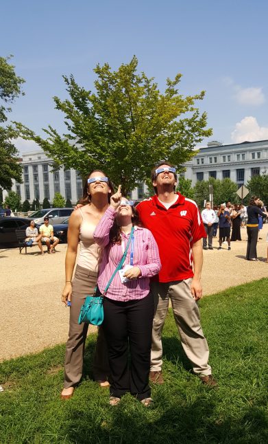 The author, xx, and CSN Managing Director Mike Schwartz watching the Eclipse in DC.