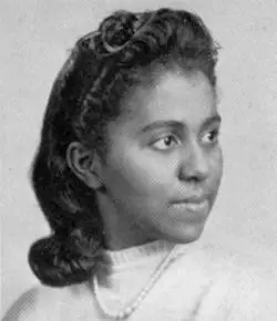 Black & white portrait of a young Black woman in a white shirt